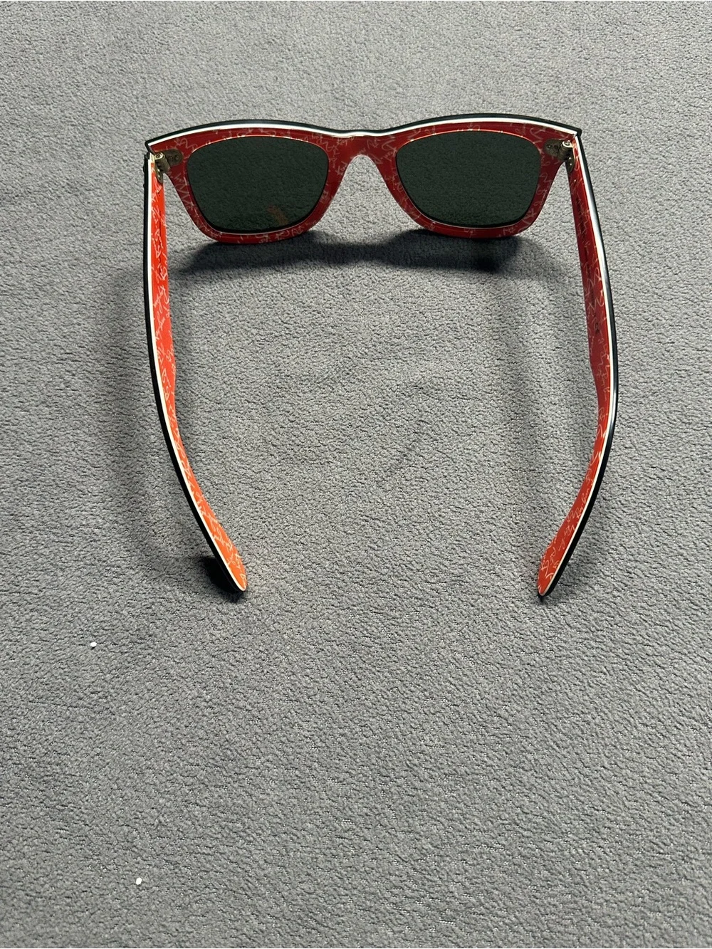 Ray-Ban Black Frame Sunglasses with Red Temples and Green Lenses